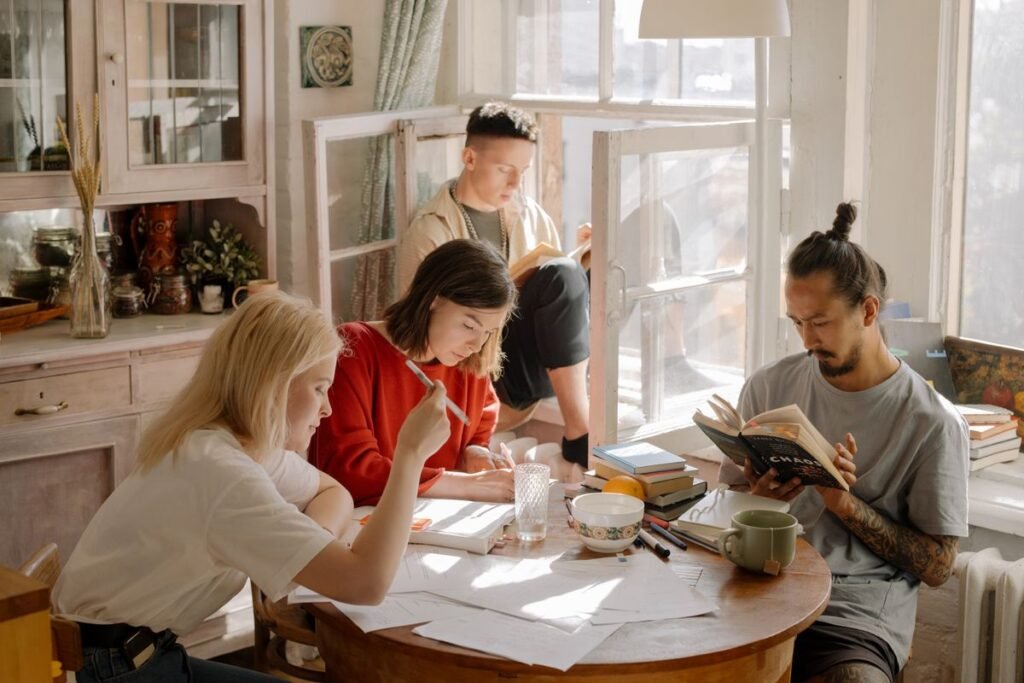 Students studying together with books and notes