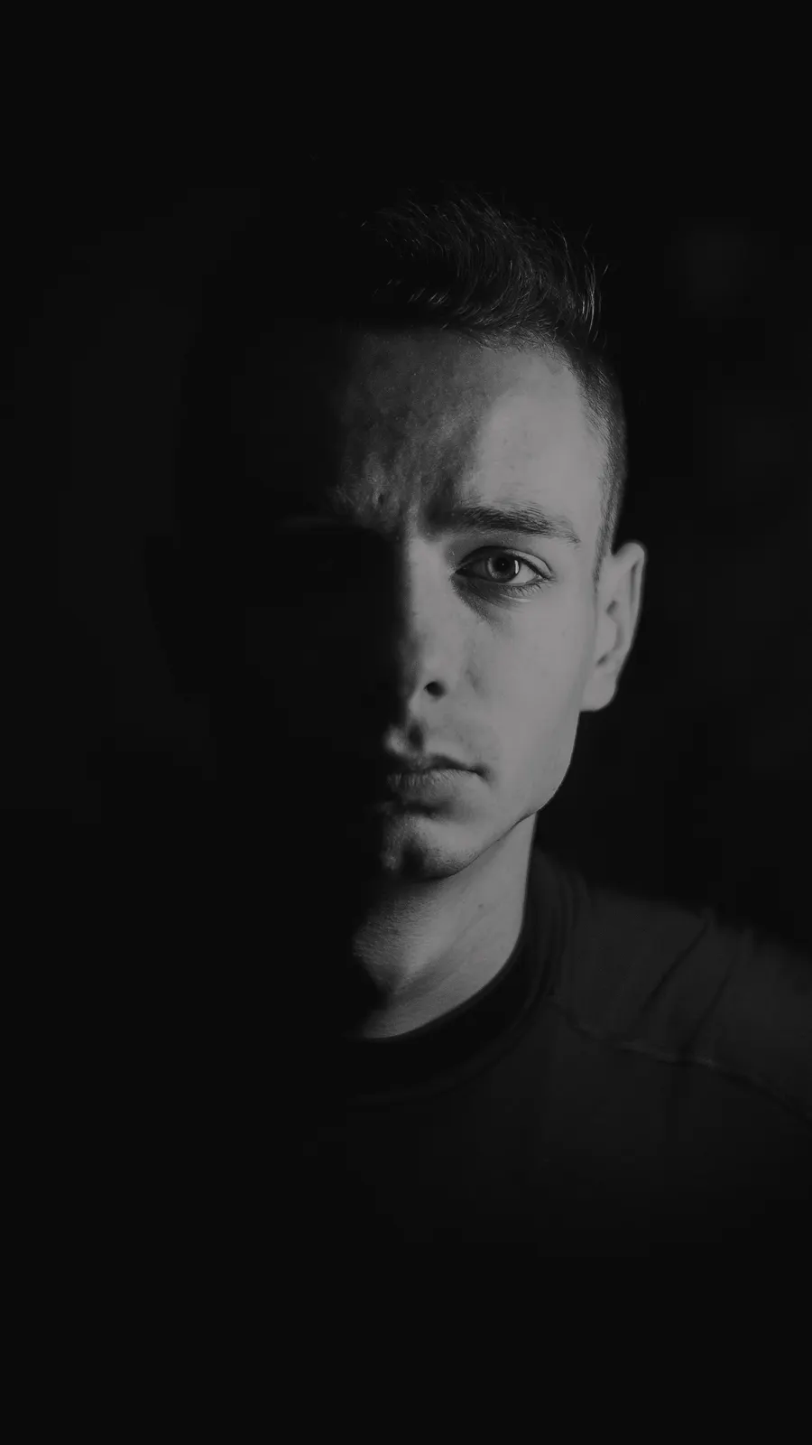 Close monochrome portrait against a dark background