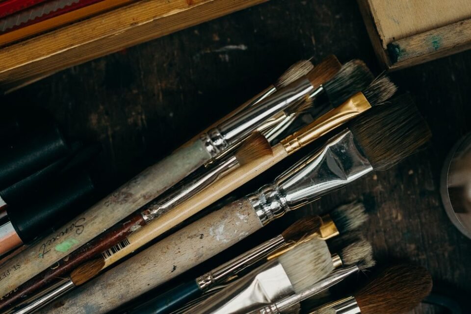 Well-used paintbrushes in an artist's studio