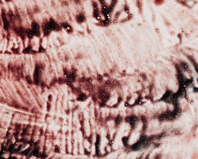 Watercolour study of vertical lines and dark droplets