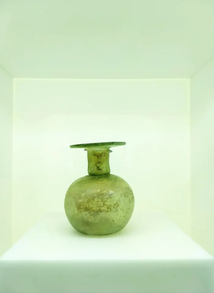 Green glass twin-handled vase