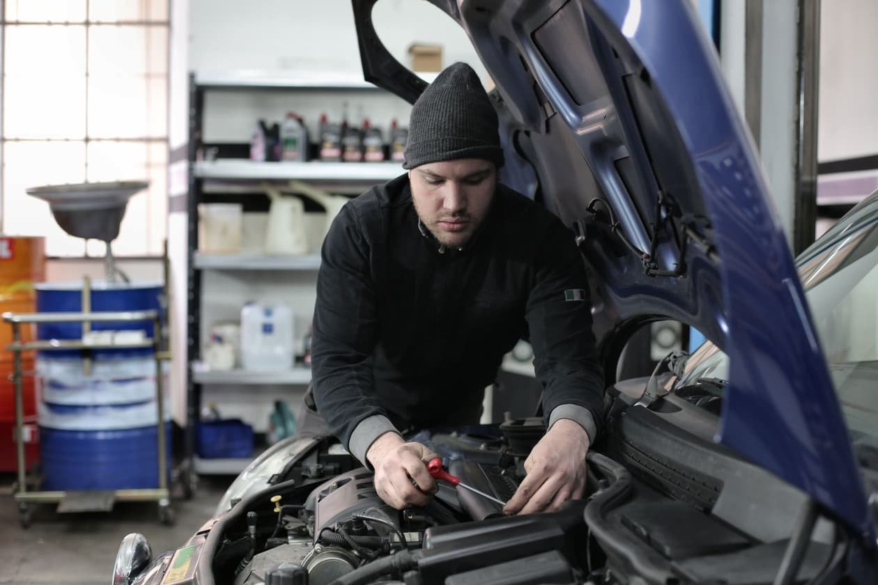 Mechanic repairing a car engine