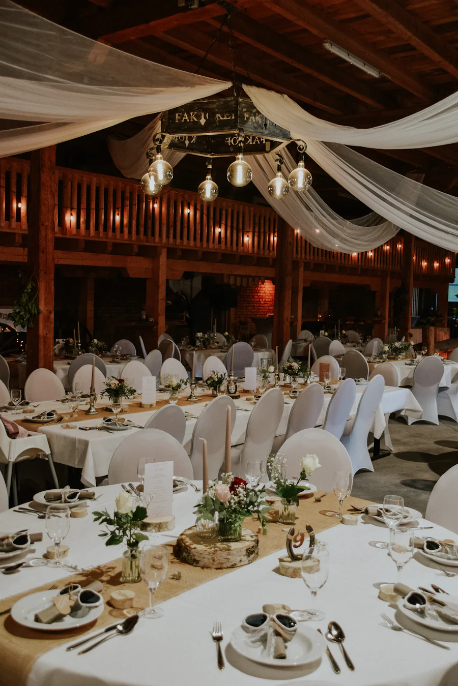 Long banquet tables dressed for a reception