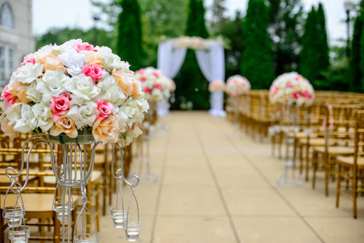 White and pink aisle flower arrangement