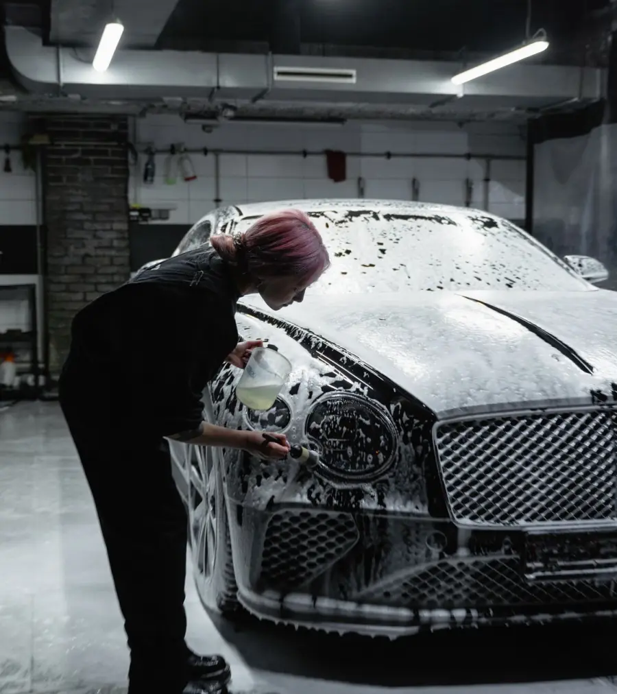 Luxury car covered in snow foam inside the SWP Car Wash bay