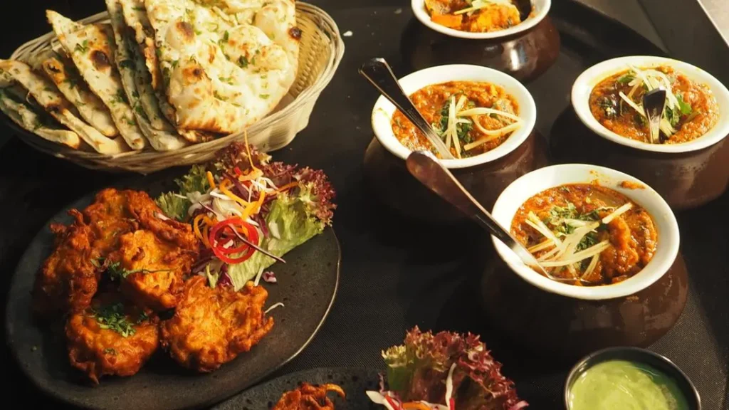 Table spread with a variety of shared dishes