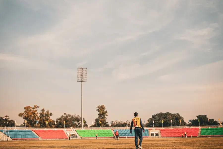 Cricket players practising in a stadium