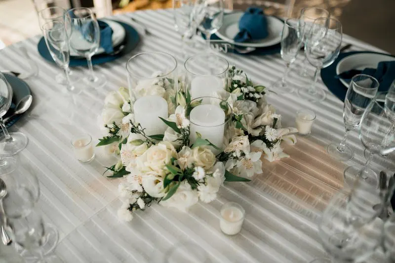 White floral centerpiece with candles