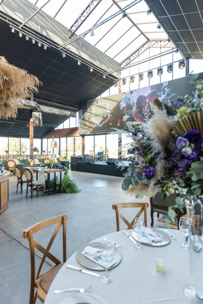 Spacious reception hall with floral arrangements and natural light