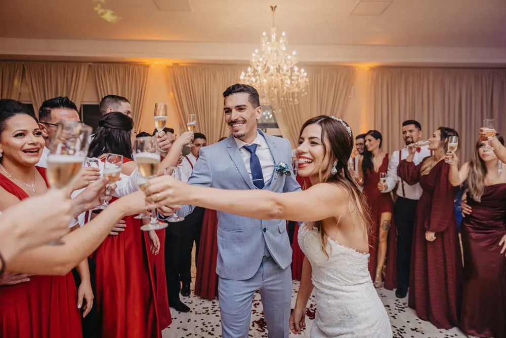 Couple and guests raising glasses for a toast