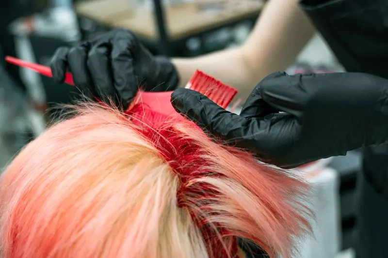 Vivid hair colour being applied