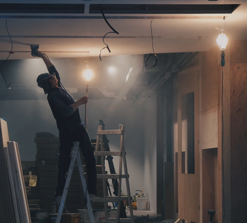 Builder finishing exterior trim on a house