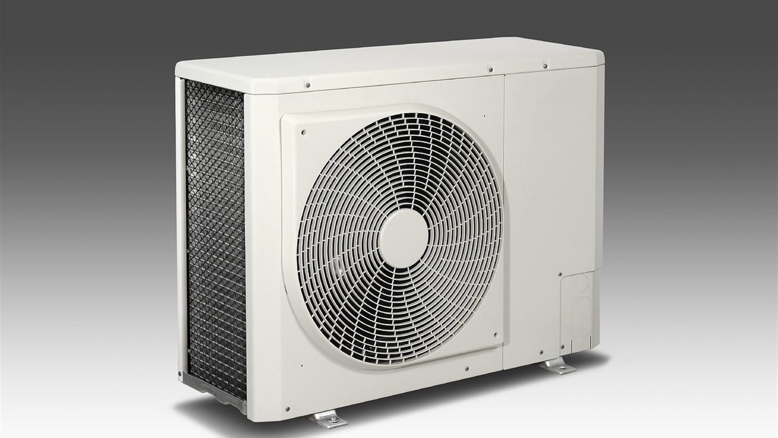 Outdoor air conditioning condenser unit mounted on a building