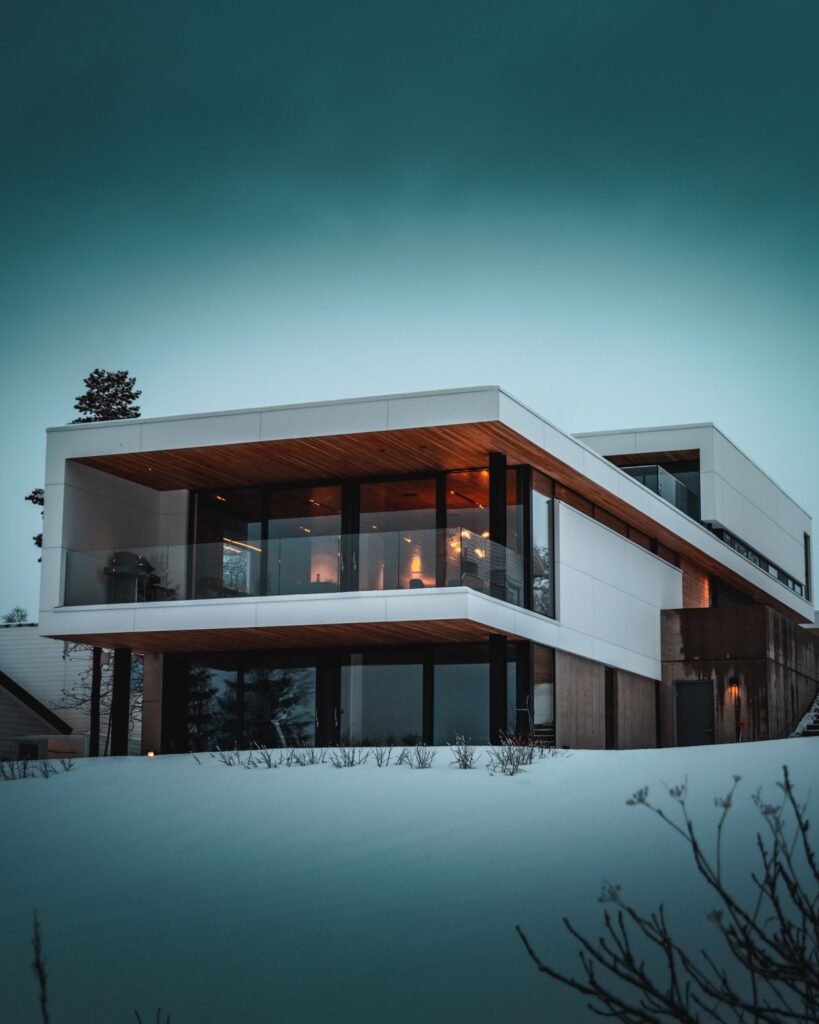 Northlight Glass House in a snowy landscape