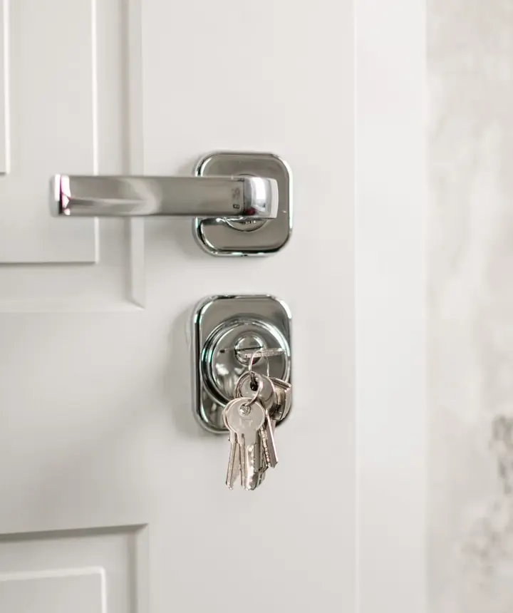 Keys hanging in a modern door handle