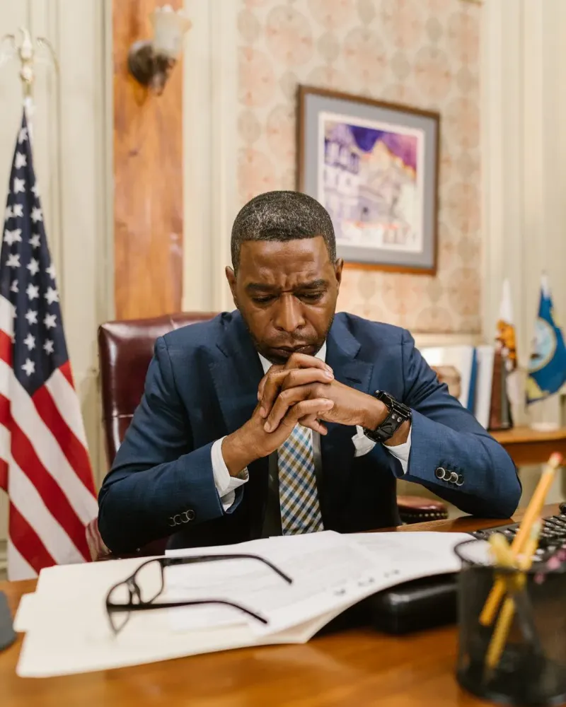 SWP attorney in a blue suit reviewing case documents