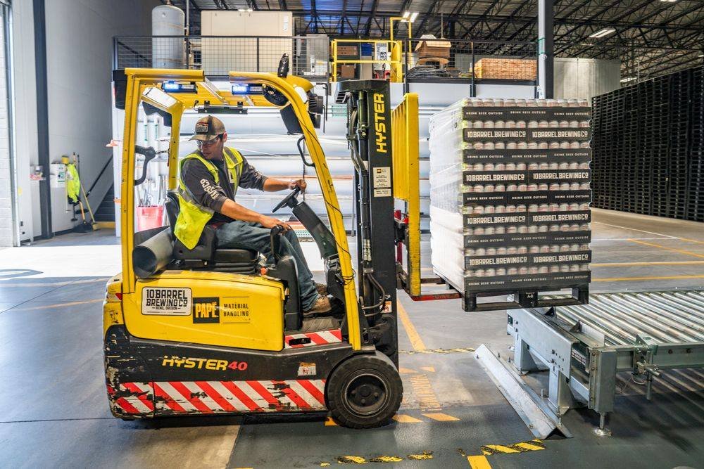 Warehouse worker operating a forklift