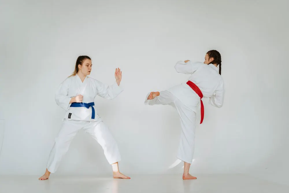 Two students sparring in karate uniforms