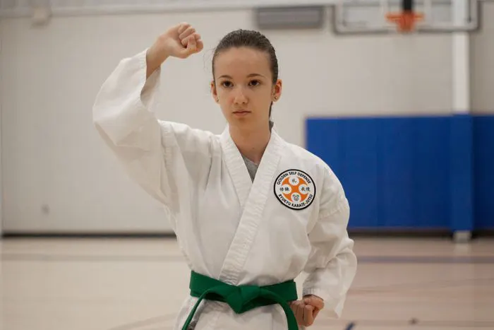 Young girl practicing karate