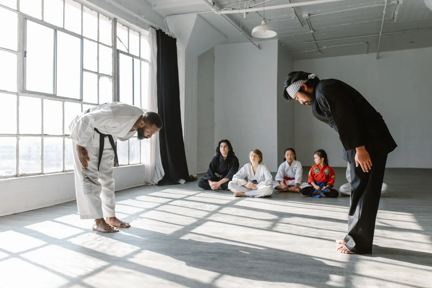 Instructors bowing to each other at the start of class