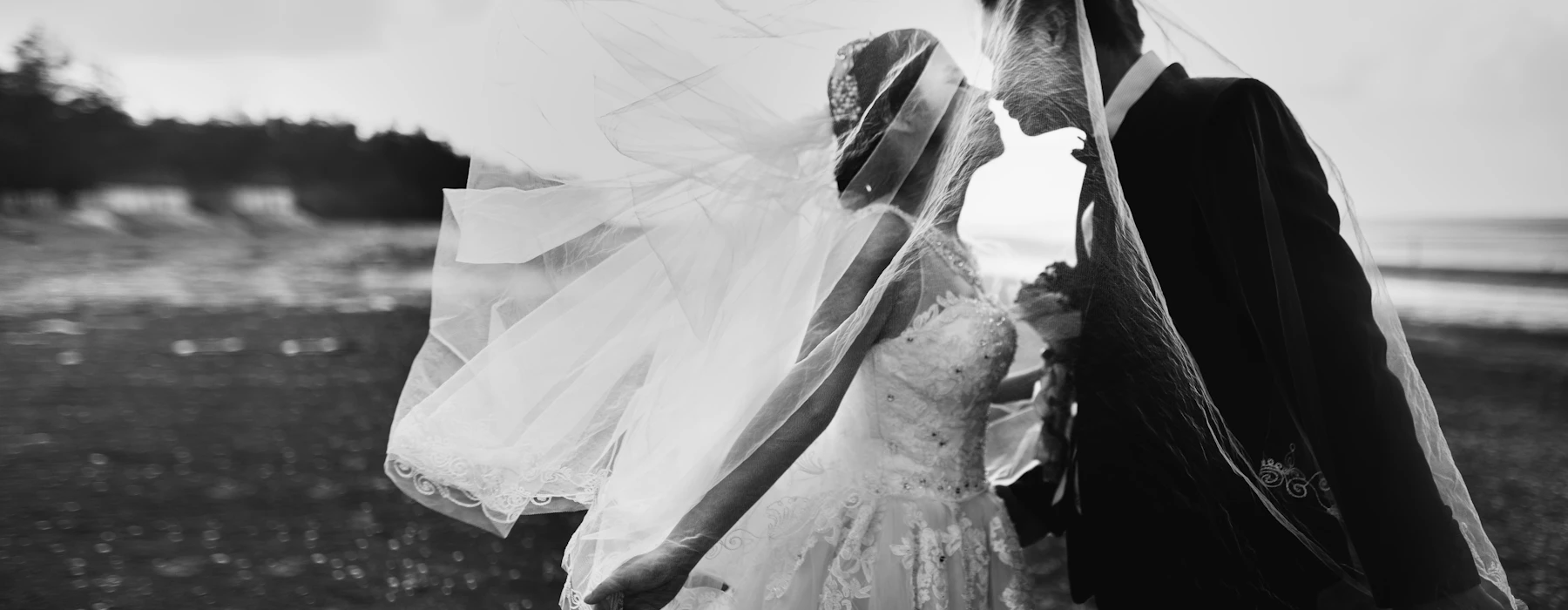 Bride and groom sharing a moment by the sea