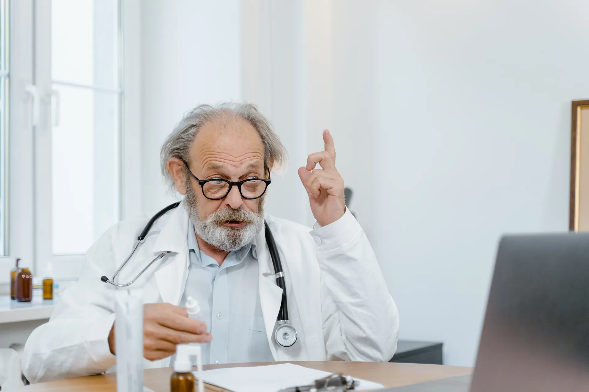 Senior doctor giving an online consultation