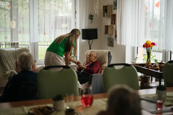 Caregiver spending time with elderly women
