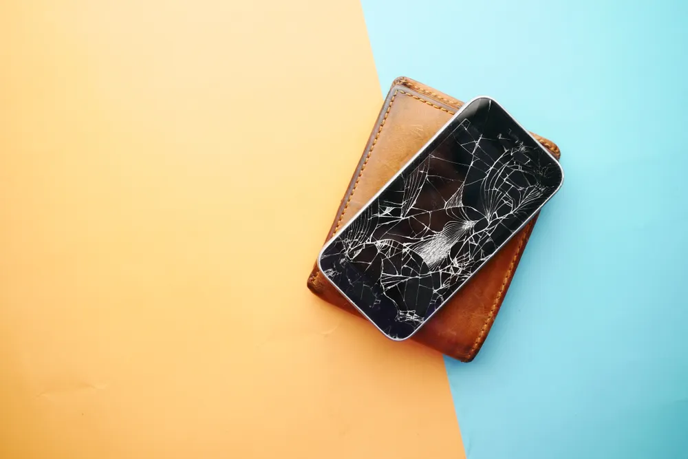 Before: phone with a cracked screen