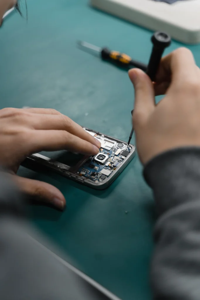 Technician replacing a smartphone part