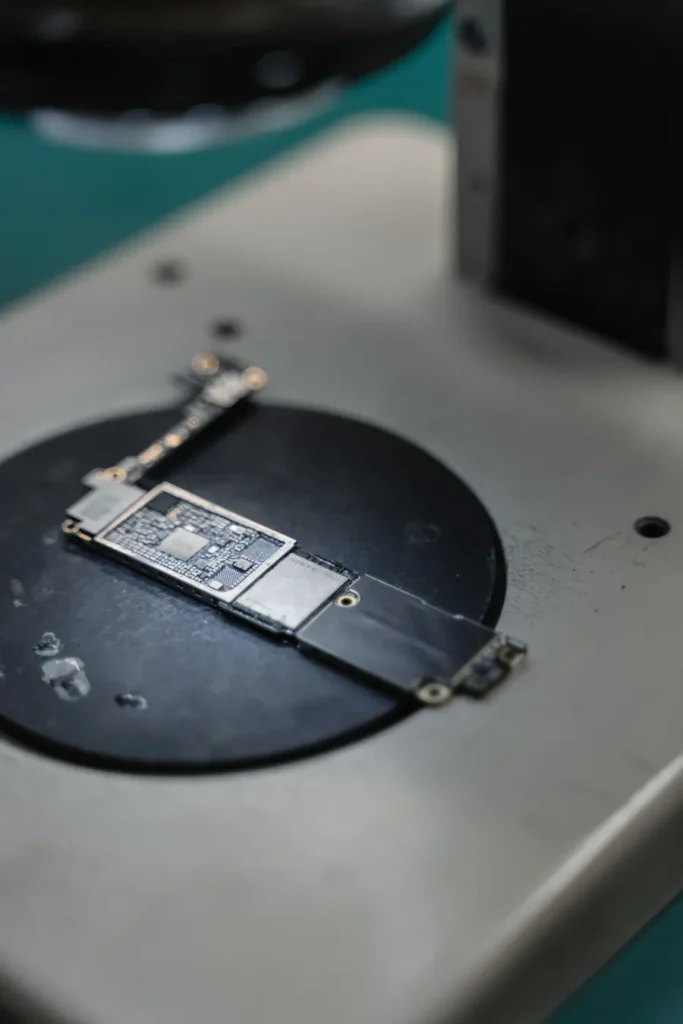 Smartphone motherboard on a workbench