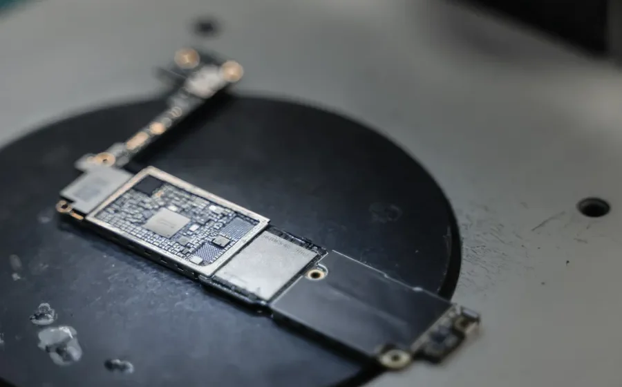 Smartphone motherboard on a workbench