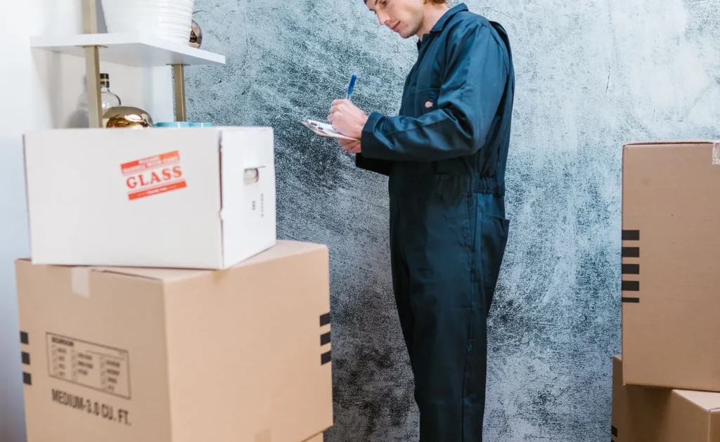 Mover labelling packed cardboard boxes