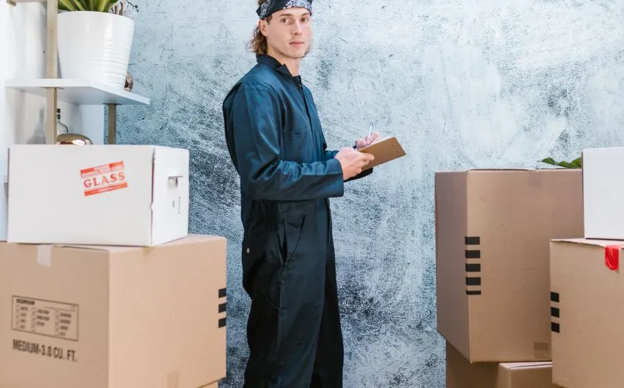 Mover checking packages in a warehouse