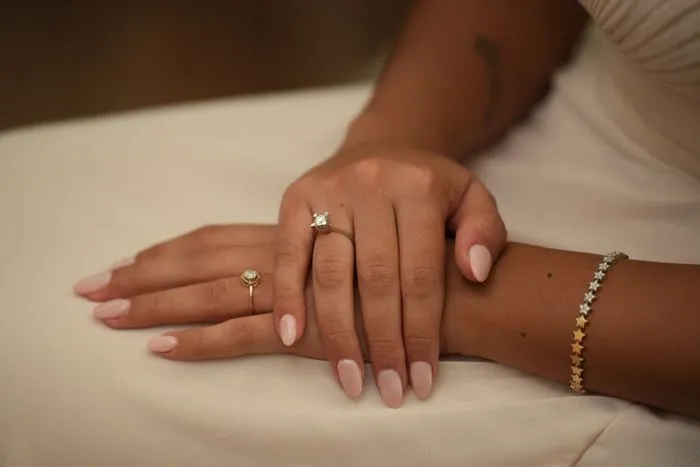 Soft pink manicure with rings
