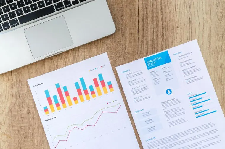 Printed charts and graphs on a desk