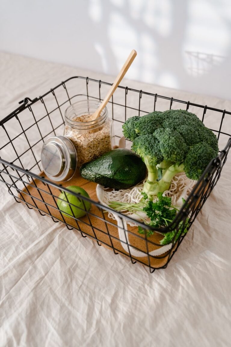 Fresh broccoli and produce in a wire basket