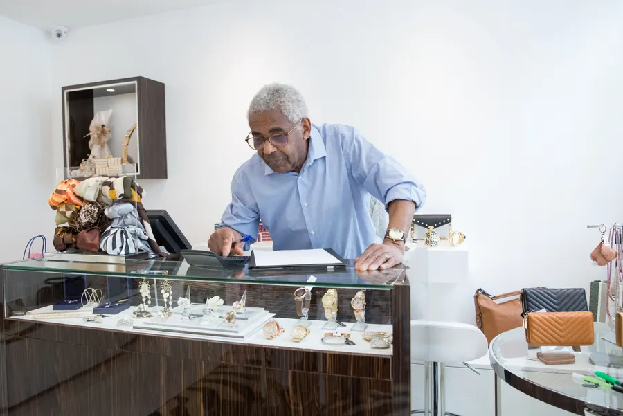 Appraiser at the counter working out a valuation