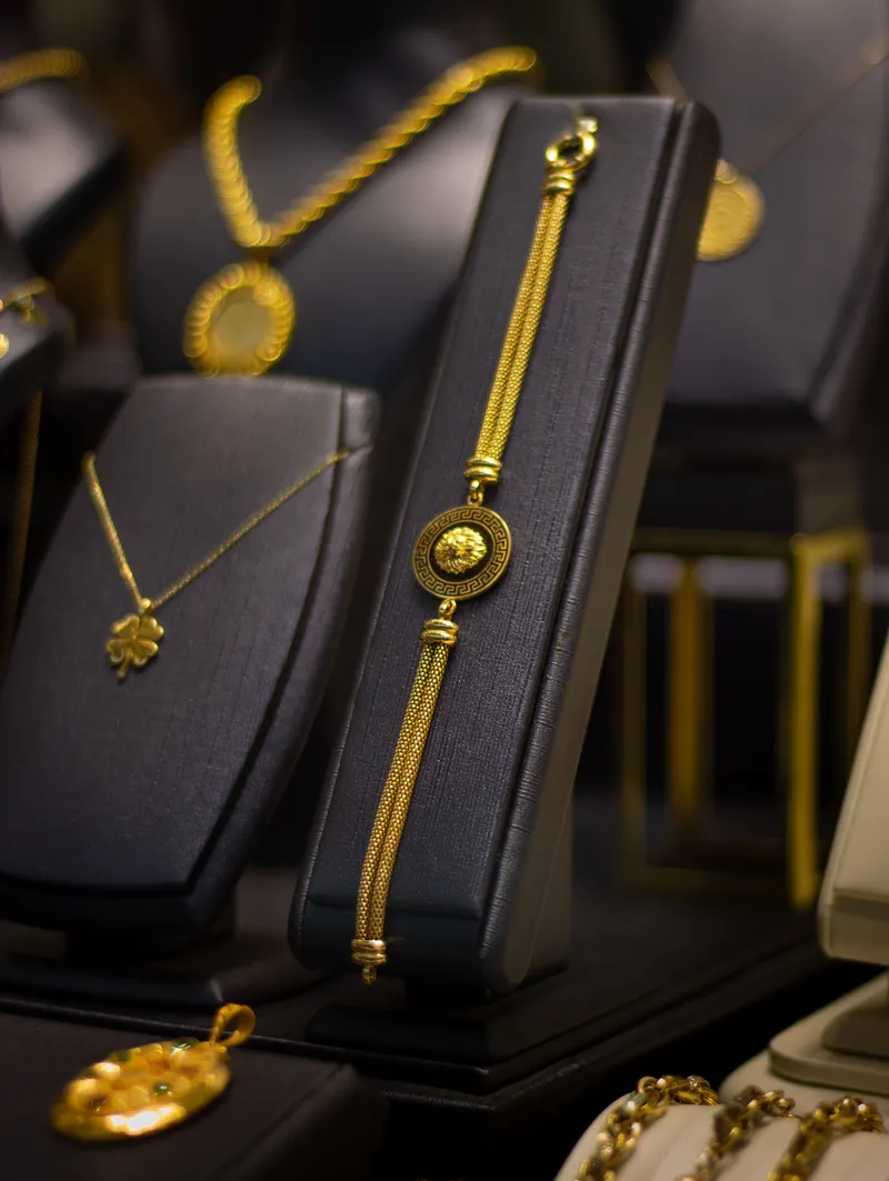 Gold jewellery laid out for weighing