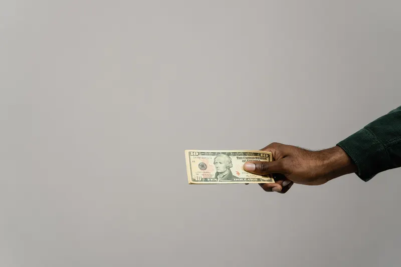 Cash being handed across the counter