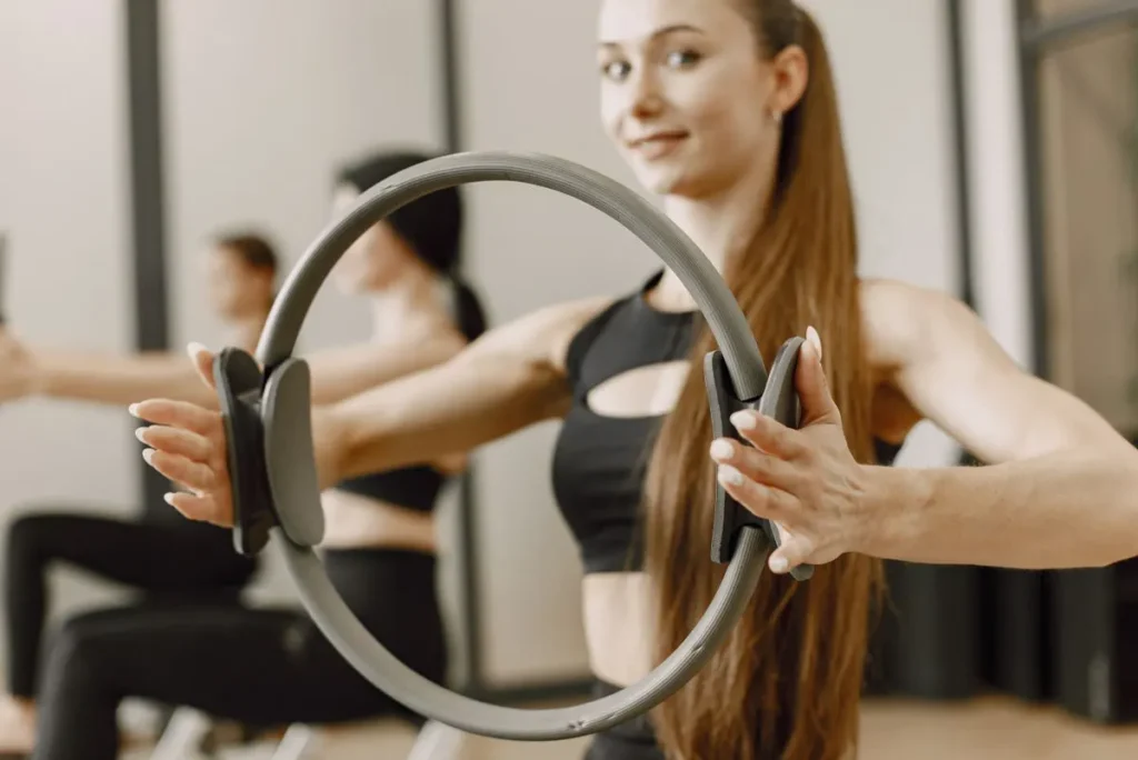 Women exercising with Pilates magic rings