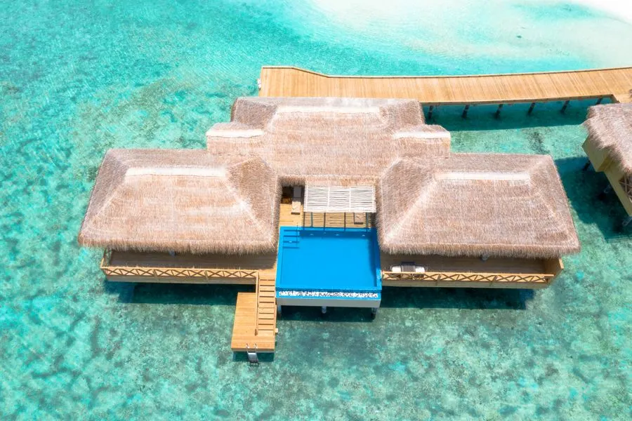Overwater villa above a turquoise lagoon