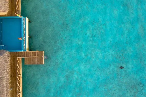 Resort swimming pool with sun loungers