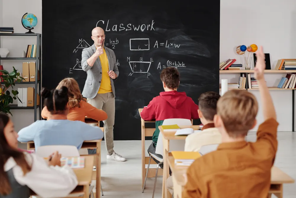Teacher guiding students during a lesson