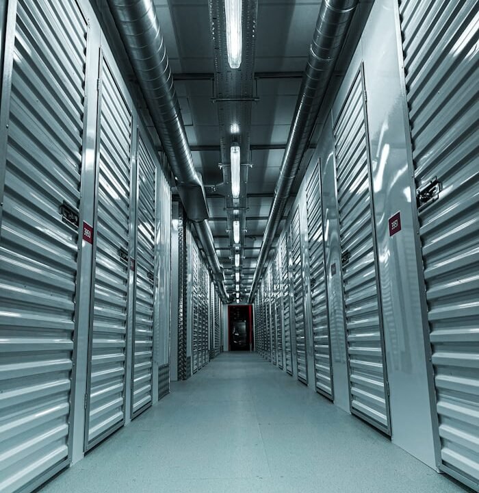 A clean metal-walled corridor inside a storage building