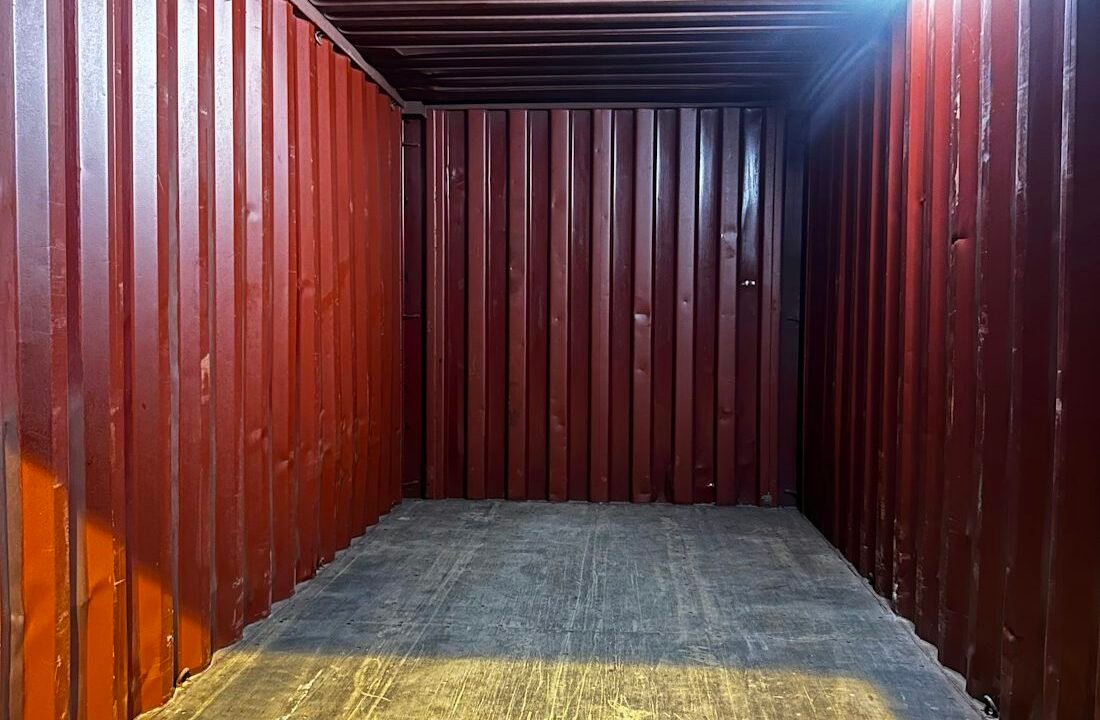 Interior of a storage building lined with numbered container units