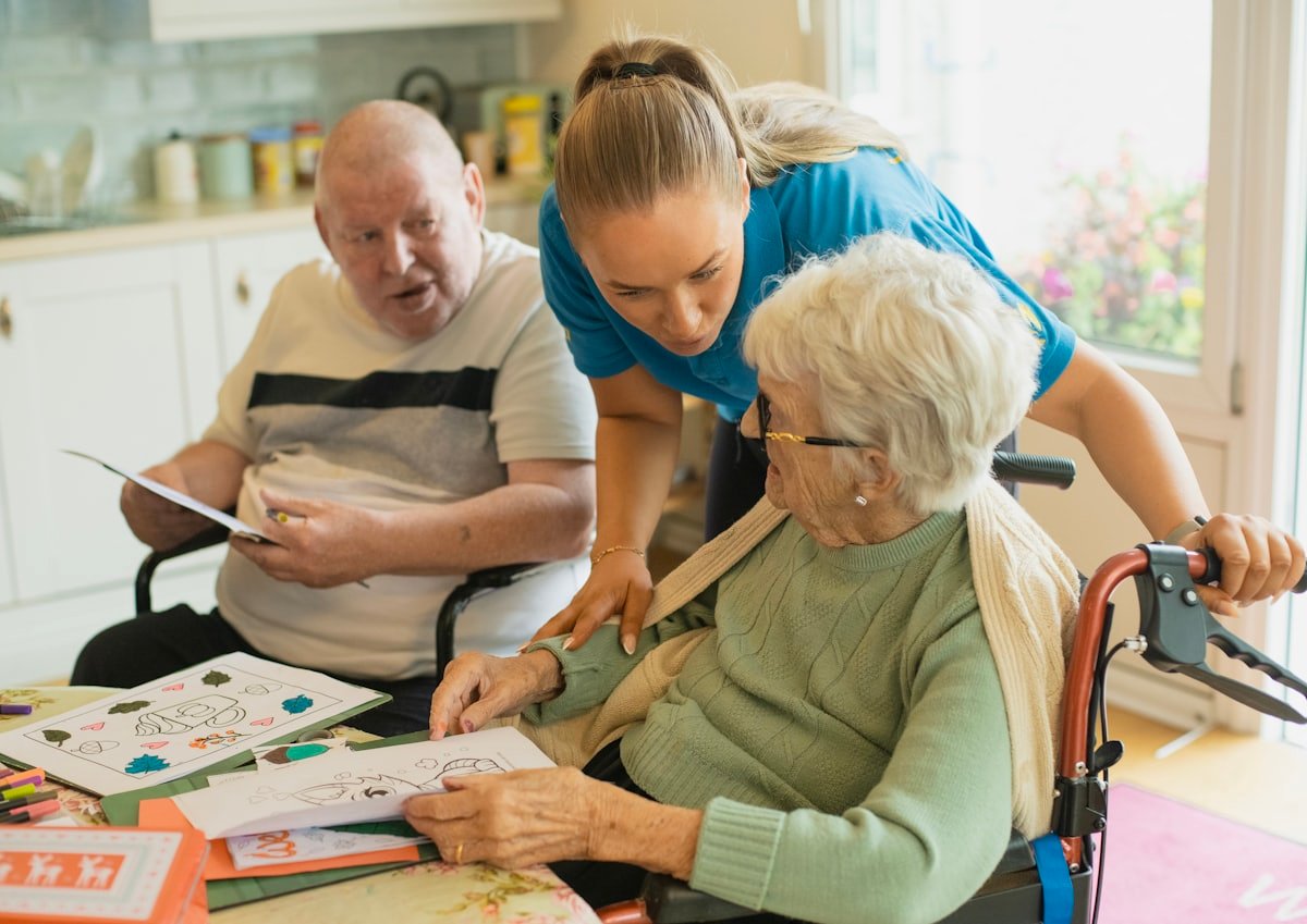 A caregiver with clients at home