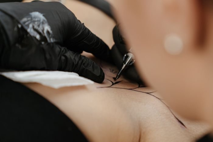 Artist shading with a tattoo machine