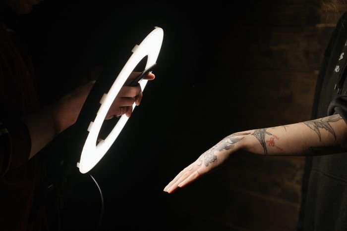 Tattoo being created under studio lighting