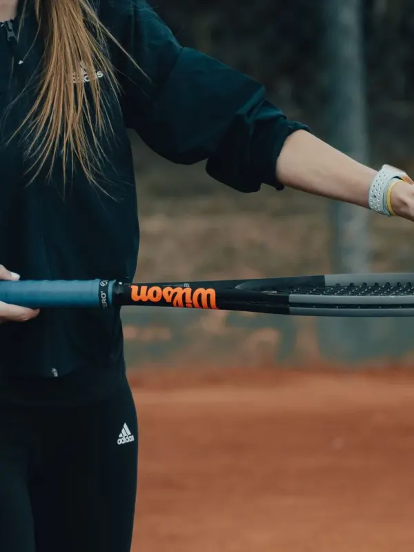 Coach Sofia Marin holding racquet and ball