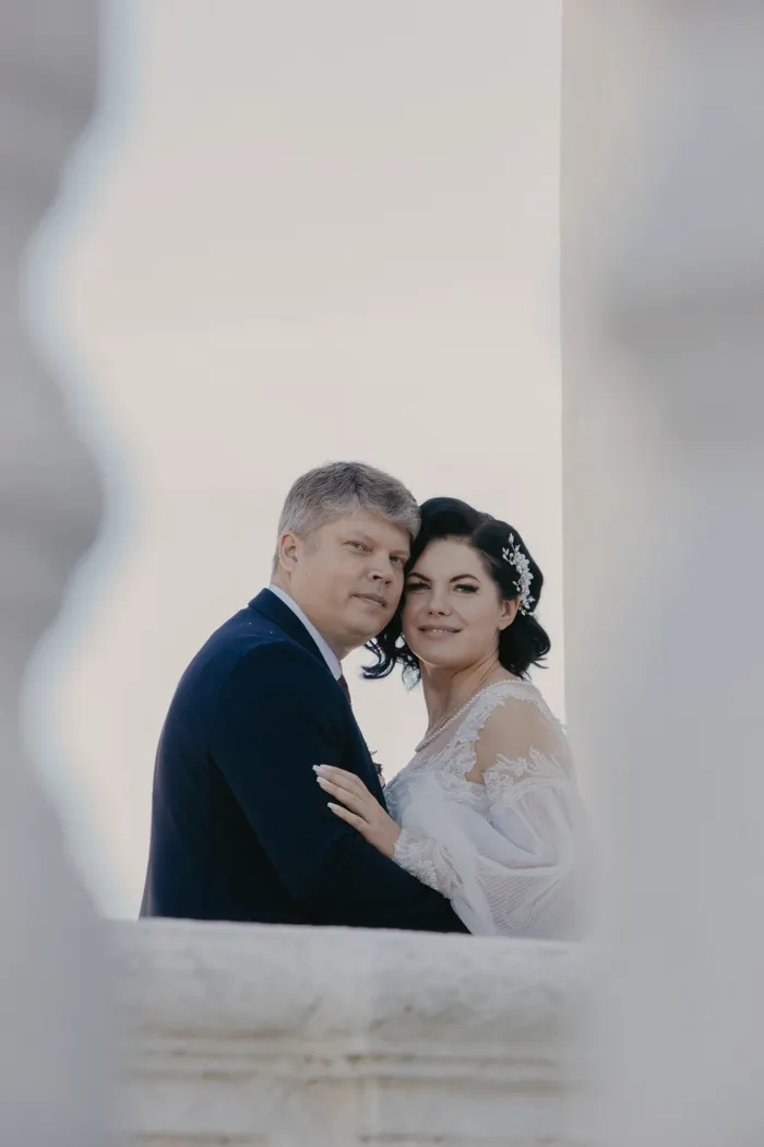 Couple embracing on a balcony